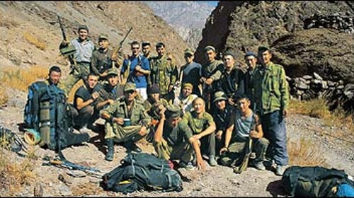 K-Team: Garth Willis (in blue) with Kyrgyz soldiers at the Forward Military Post in the Karavshin, October 2002