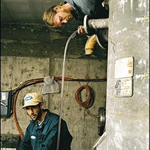 Slippery Hope: biodiesel entrepreneur Charris Ford (bottom), with colleague Nickolai Cowell, at work in their Colorado warehouse