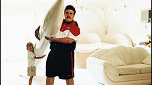 Father, son, and nose cone: Ky in his Minnesota living room, with three-year-old Buddy Rocketman Michaelson