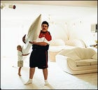 Father, son, and nose cone: Ky in his Minnesota living room, with three-year-old Buddy Rocketman Michaelson