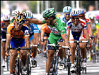 Robbie McEwen pats Oscar Freire on the shoulder after Freire's Stage 9 win.