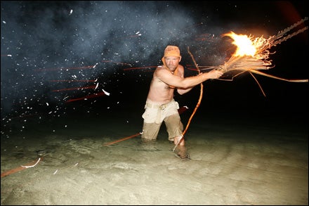 Stroud spearfishes by torchlight.