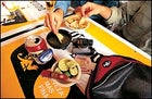 Petzl Zipka Headlamp, Nikon Sportstar III 8x25, Eagle Creek's Pack-It System, and Victorinox Swiss Army Altimeter Knife