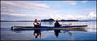 Cutting across the glass-smooth surface of Kasitsna Bay