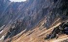 85 MILES DOWN, 15 TO GO: Hardrocker Ken Jensen makes his way over Grant Swamp Pass after surviving the course's hardest climb, in the San Juan Mountains.