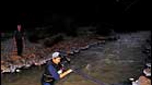 Aggh, That's Cold: A color-coordinated runner wades through the Uncompaghre River.