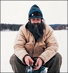 Genuine ring-spun, duck-cloth bliss: local trapper Rick Schiesl ice-fishing near Talkeetna in his Carhartt finest