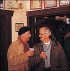 Ball glitterati Kenny Umphenour and Cliff Hudson talking pants in between swigs