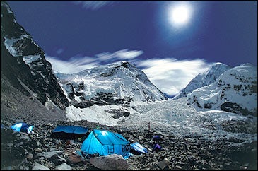 Lights on: an expedition awaits the dawn at the base of Mount Everest.