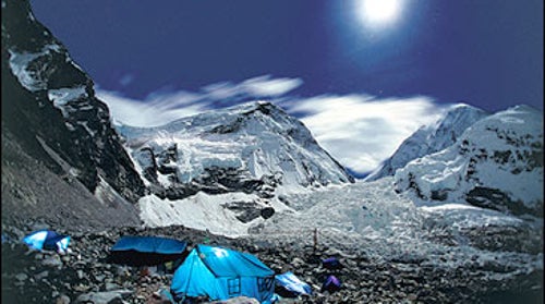 Lights on: an expedition awaits the dawn at the base of Mount Everest.
