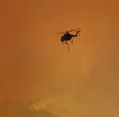 A heavy-lift helicopter makes a run to the Rio Grande for water.