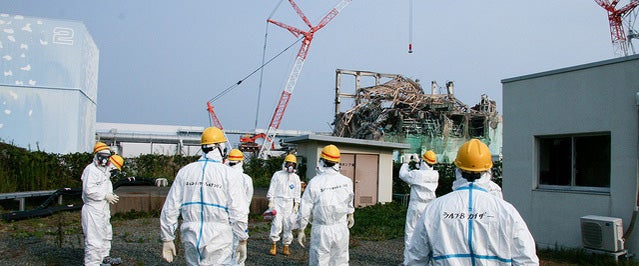 Plant workers attempt to measure radiation levels at the Fukushima Daiichi plant.