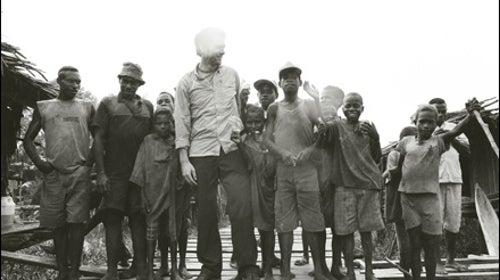 Tim Sohn with Momogu villagers