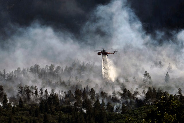 Helicopter dropping water on the Waldo Canyon fire.