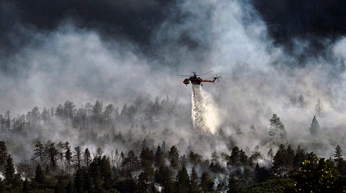 Helicopter dropping water on the Waldo Canyon fire.