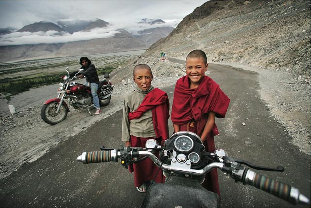 Buddhist monks as seen from a Royal Enfield in Ladakh India