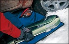 The Burton Cascade SPLT 70 snowboard, the DaKine Dually, and waterproof Smartwool Bacountry Mittens