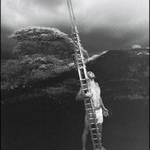 CARRY A BIG STICK: Stone, with a he'e holua sled, in Keauhou, Hawaii