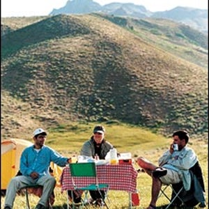 Kicking back in the Elburz: left to right, Shahram, the author, and Abbas Jafari meadow-camping at 9,000 feet.