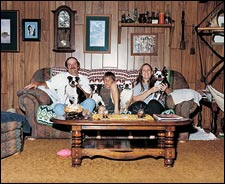 Pause, then play: from left, Dave, Roger, and Terrie Carver, with Black Jack, Longtail, Bubba, and Wilma