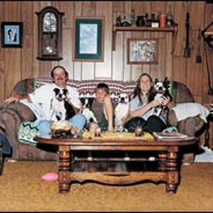 Pause, then play: from left, Dave, Roger, and Terrie Carver, with Black Jack, Longtail, Bubba, and Wilma