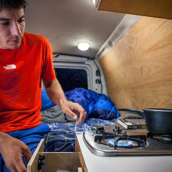 “Dinner time! After years of just having a Coleman camp stove bolted to my counter, the newest version of my van is a bit better built.”