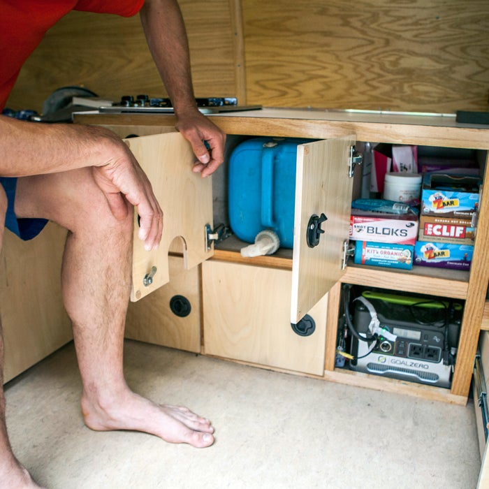 “Custom-sized water drawer that keeps my five-gallon jug hidden away. Plus the snack cabinet, with enough Clif product to power me up anything. Notice the Goal Zero batteries hidden down below.”