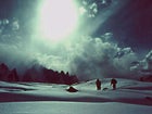 Steady on: Porters traverse a glacier near Snow Lake.