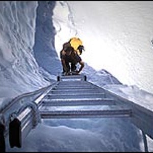 Climbing a ladder on Everest's Khumbu Ice Fall