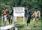 Joint custody: the Burmese soldiers who escorted the author to the India border at the summit of Pangsau Pass, where he was met by Indian commander Y.S. Rama (next page, in blue)
