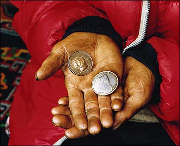 Pemba Tharké Sherpa holding the coveted Tiger Medal, bestowed on many of the greatest Sherpas, and a token from the 1965 Indian Everest Expedition