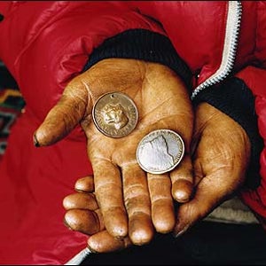 Pemba Tharké Sherpa holding the coveted Tiger Medal, bestowed on many of the greatest Sherpas, and a token from the 1965 Indian Everest Expedition