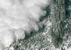 An avalanche rips down a mountainside.