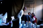Dr. Lucy Doyle, a physician with Doctors Without Borders, examines patients in a makeshift medical clinic in a building at the Ocean Village housing complex.