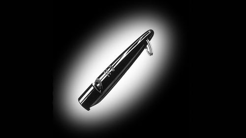 An ACME high-pitched penny whistle, commonly used for training dogs.