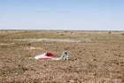 Pilot Felix Baumgartner of Austria celebrates after successfully completing the final manned flight for Red Bull Stratos.