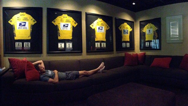 Lance Armstrong with his yellow jerseys.