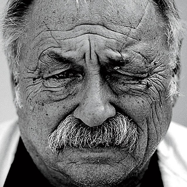 adult American Caucasian ethnicity cigarette facial hair head and shoulders Jim Harrison literary arts male men middle-aged middle-aged man mustache North American one one person people portrait prominent persons rudy waks smoking studio shot wrinkled writer