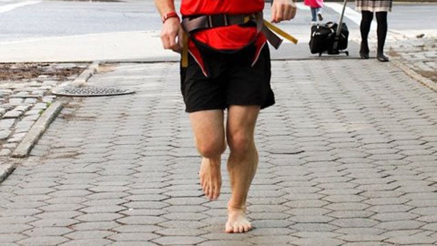 Man Running Barefoot In Water Stock Photo - Download Image Now