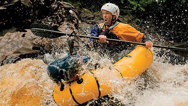 Running a class three rapid below Rafters Basin color image photography outdoors day one person mature adult mature men front view boating rafting inflatable raft packraft raft helmet transportation paddling rapids rivers speed adventure risk danger life jacket life preserver outdoor pursuit leisure activity fun motion action water splashes rock color image photography outdoors day one person mature adult mature men front view boating rafting inflatable raft packraft raft helmet transportation paddling rapids rivers speed adventure risk danger life jacket life preserver outdoor pursuit leisure activity fun motion action water splashes rock rafters basin class three rapid franklin river tasmania australia horizontal