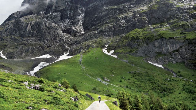 Berner Oberland Bernese Alps Bernese Oberland Europe Grosse Scheidegg Magic Image Summer Swiss Alps Switzerland The Magic bike biking blue sky cloudy day cycling figure in a landscape fitness horizontal male moody one man one person rain road bike road biking road riding sunny day weather