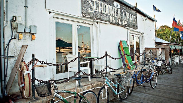 key west schooner wharf bar bicycles bike bikes structure building US USA america day daylight daytime exotic florida island keys no people nobody ocean outdoors outside tropical tropics quirky quaint eccentric south southern carefree whimiscal horizontal