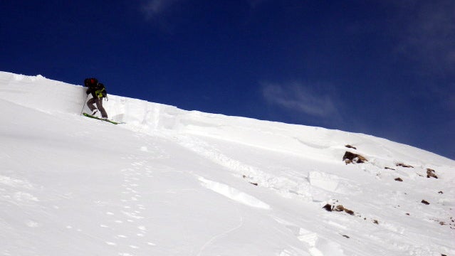 Tim Brown examines the crown face of the avalanche.