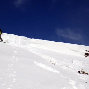 Tim Brown examines the crown face of the avalanche.