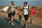 Engle (left) with Ray Zahab running the Sahara