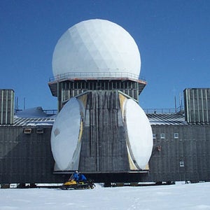 DYE-2 station, snowmobile in front for scale.