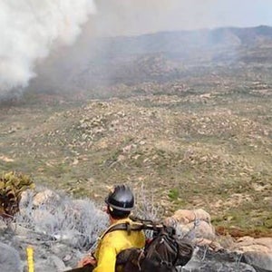 The last text message Michelle Parker received on Sunday from her son, hot shot firefighter Wade Parker, arrived at 4:04 p.m. and included this photograph he had taken from a ridgeline overlooking a massive wall of gray smoke surging toward Yarnell, a town of 500 mostly retirees: 