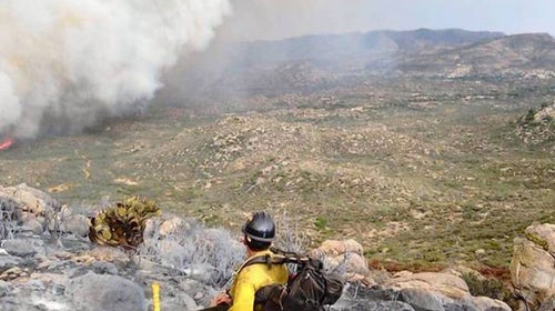 The last text message Michelle Parker received on Sunday from her son, hot shot firefighter Wade Parker, arrived at 4:04 p.m. and included this photograph he had taken from a ridgeline overlooking a massive wall of gray smoke surging toward Yarnell, a town of 500 mostly retirees: 
