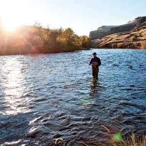 adult adventure afternoon beauty beauty in nature bend Cascade Range copy space daytime Deschutes River dry fish fishing fly fishing front view light mountain natural North America one one person Oregon Pacific Northwest Pacific States people sports steelhead sunshine trout USA waders water