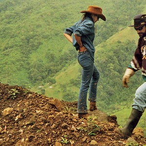 John and Ann inspecting road damage after a landslide.